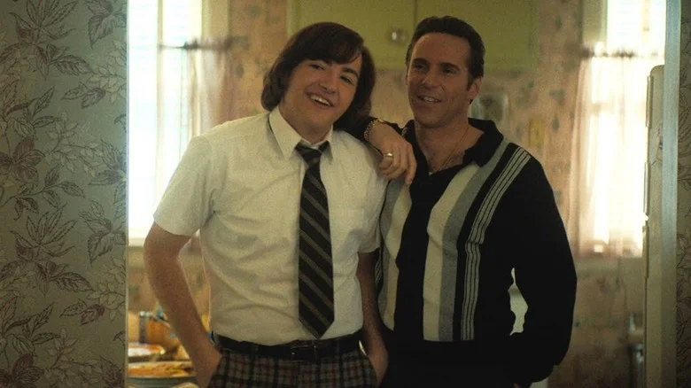 Michael Gandolfini as Tony Soprano and Alessandro Nivola as Dickie Moltisanti share a rare moment of warmth in The Many Saints of Newark