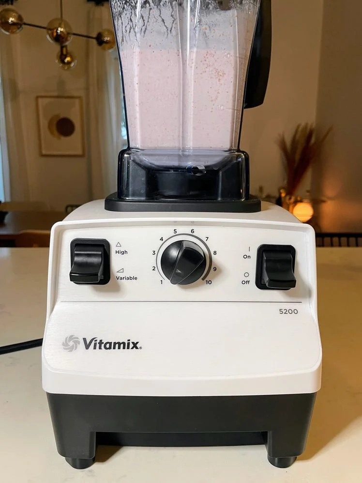 Vitamix 5200 with a smoothie in it.