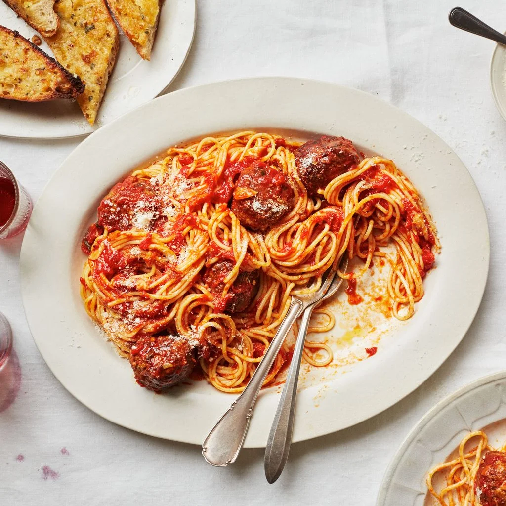 This image may contain Spaghetti Food Pasta Meal and Dish