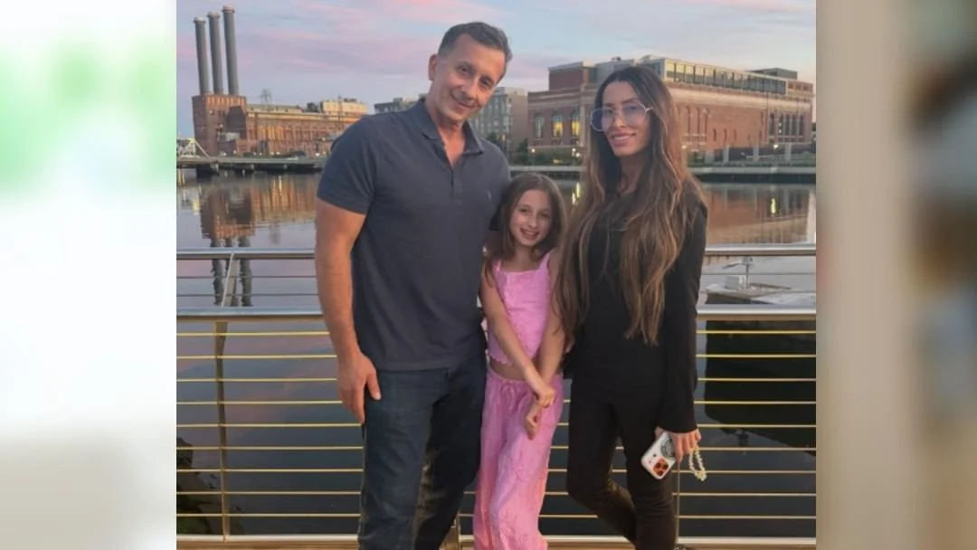 Photo of Billy Carmody, Alicia Carmody and their daughter. 