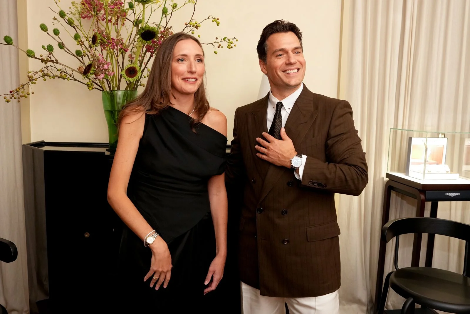 Image may contain Henry Cavill Blazer Clothing Coat Jacket Formal Wear Suit Adult Person Face Happy and Head