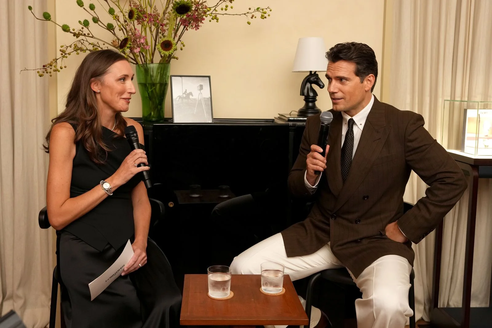 Image may contain Henry Cavill Accessories Formal Wear Tie Adult Person Conversation Interview and Cup