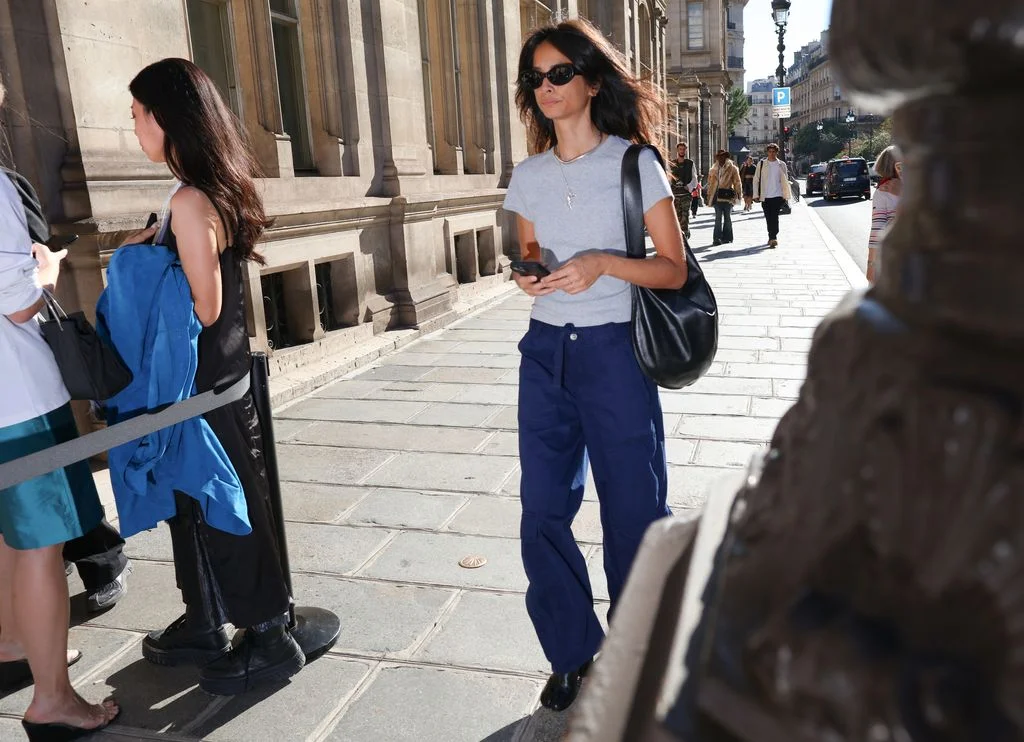 Image may contain Clothing Pants Person Jeans Accessories Bag Handbag Adult and Pedestrian