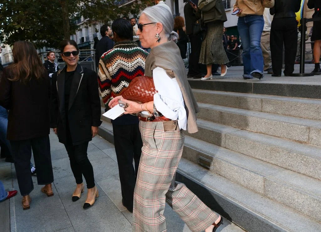 Image may contain Marta Minujín Maurizio Casagrande Clothing Pants Accessories Bag Handbag Person Adult and Glasses