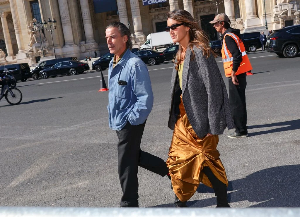 Image may contain Bla Ernyey Nora Istrefi Person Walking Pedestrian Clothing Coat Car Transportation and Vehicle