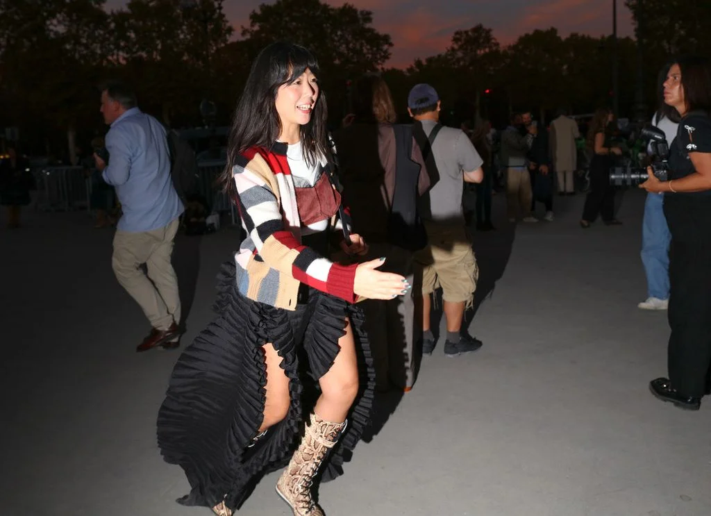 Image may contain Susanna Lau Clothing Footwear Shoe Coat Jacket Adult Person Dancing Leisure Activities and Skirt