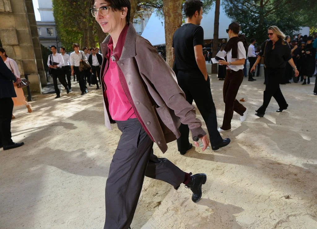 Image may contain Ana Rosa Quintana Person Walking Clothing Coat Formal Wear Suit Adult Accessories and Bag