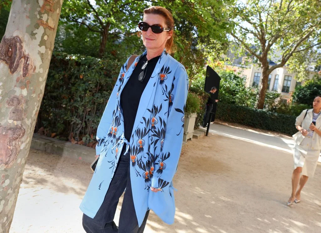 Image may contain Ruth Beckermann Clothing Coat Blazer Jacket Cape Long Sleeve Sleeve Formal Wear Person and Adult