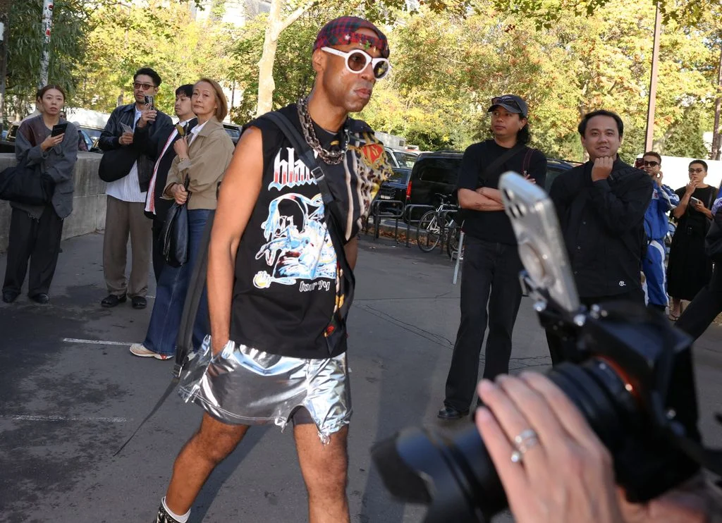 Image may contain Clothing Shorts Accessories Sunglasses Photography City Road Street Urban Person and Adult