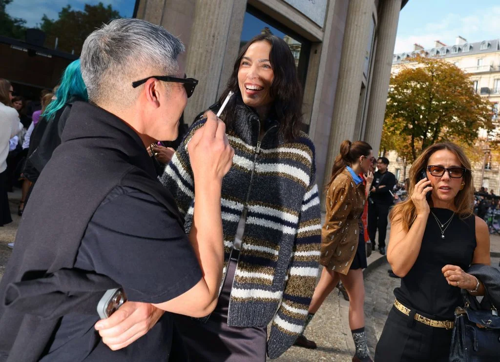 Image may contain Alexa Chung Adult Person Accessories Glasses Clothing Knitwear Sweater Face Head and Coat