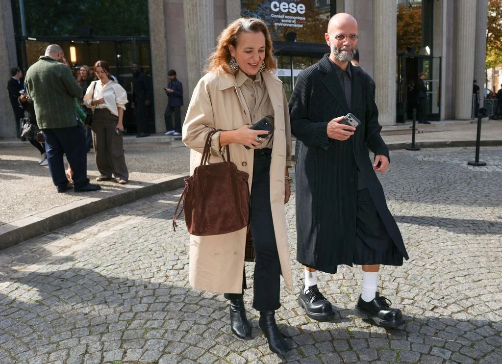 Image may contain Željko Ivanek Clothing Coat Accessories Bag Handbag Person Overcoat Footwear and Shoe