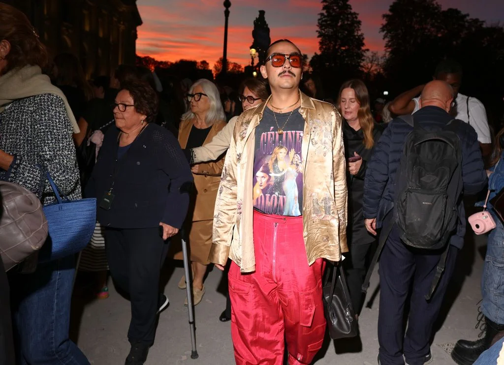 Image may contain Eva Polttila Clothing Coat Jacket Accessories Sunglasses Adult Person Pants Glasses and Blazer