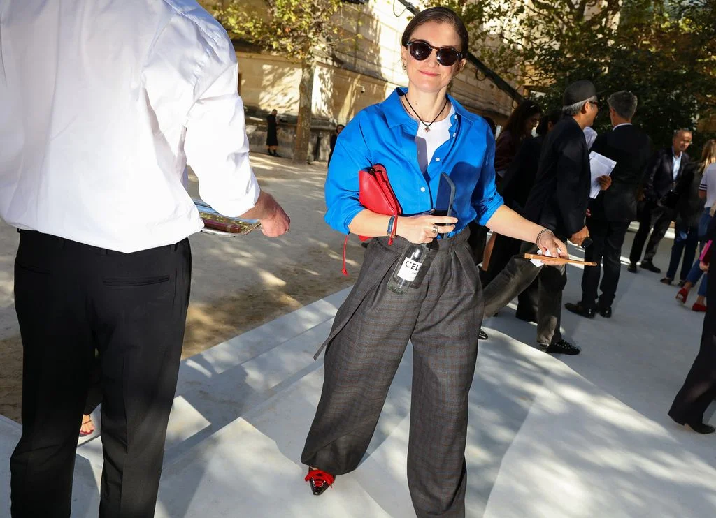 Image may contain Clothing Pants Formal Wear Suit Accessories Tie Sunglasses Shirt Adult Person Vest and Blouse