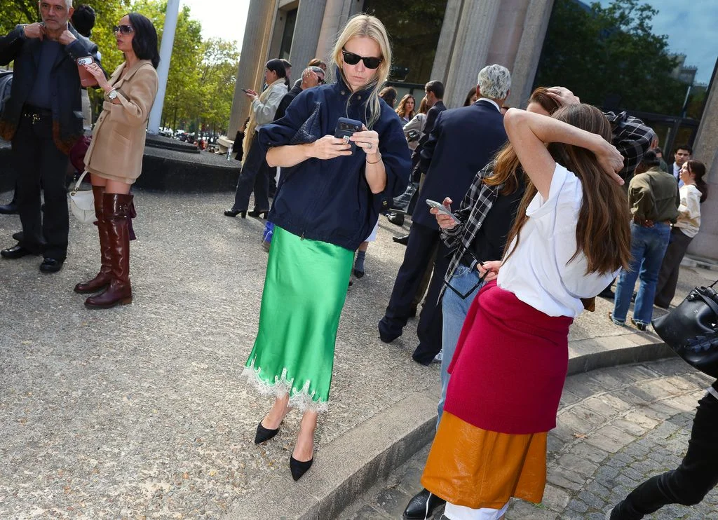 Image may contain Clothing Skirt Adult Person Dress Jeans Pants Coat and Jacket