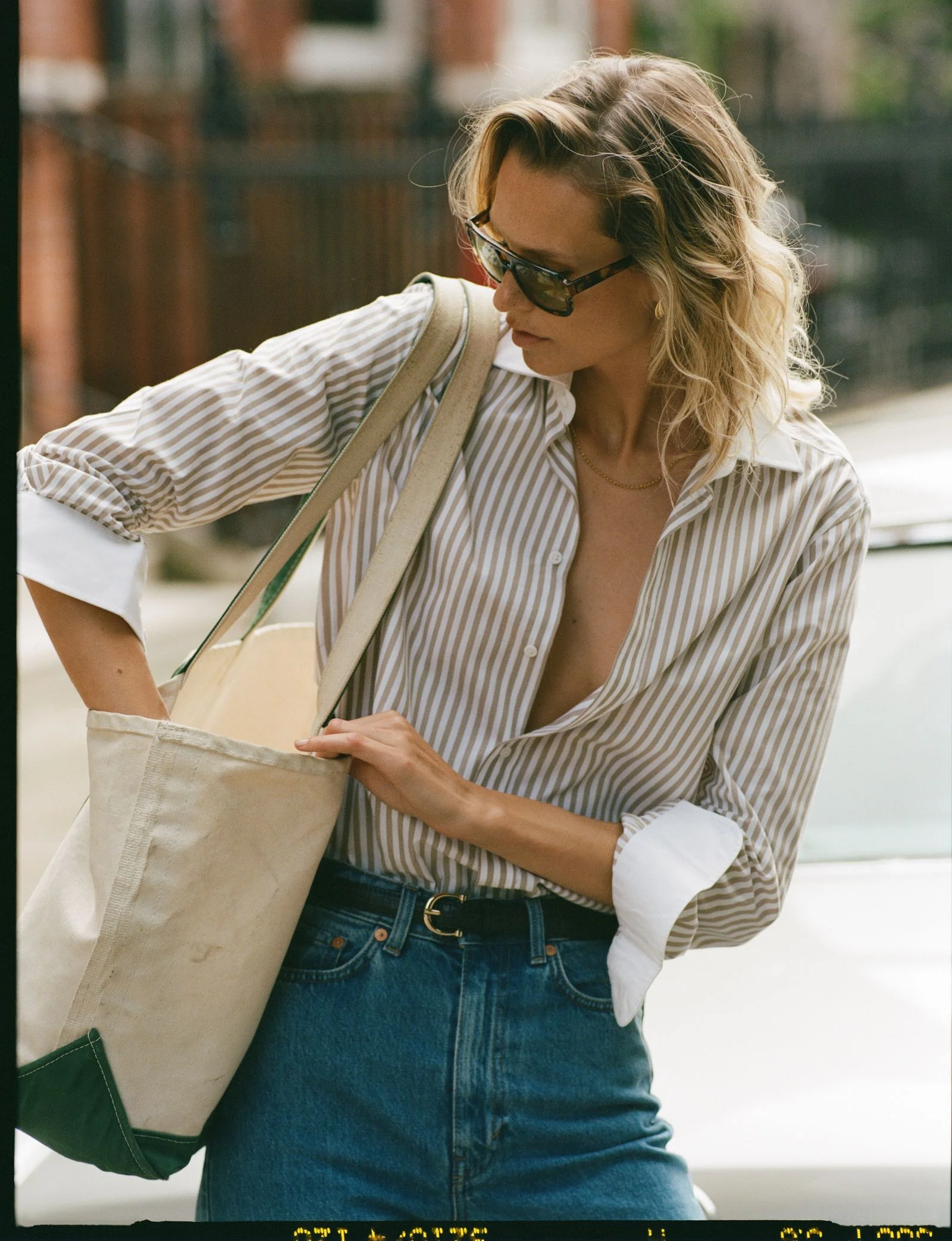 Image may contain Accessories Bag Handbag Adult Person Glasses Belt Purse Clothing Glove Blouse and Pants