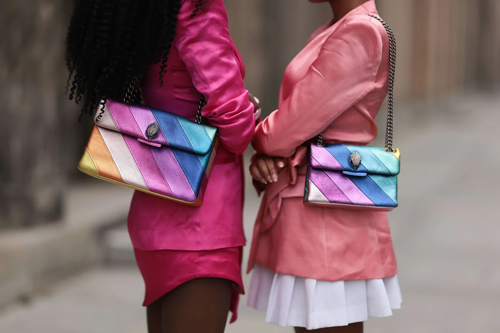 Image may contain Accessories Bag Handbag Purse Body Part Hand Person Clothing Skirt Child and Holding Hands