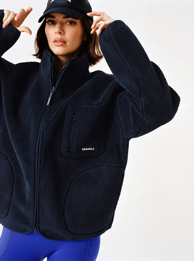 Image may contain Kendall Jenner Clothing Fleece Coat Jacket Knitwear Sweater Sweatshirt and Hoodie
