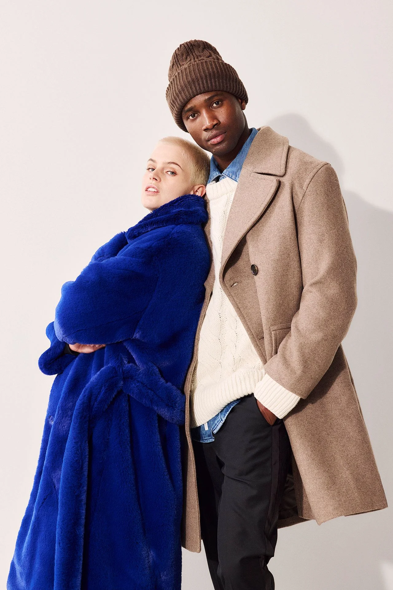Image may contain Clothing Coat Hat Adult Person Jacket and Overcoat