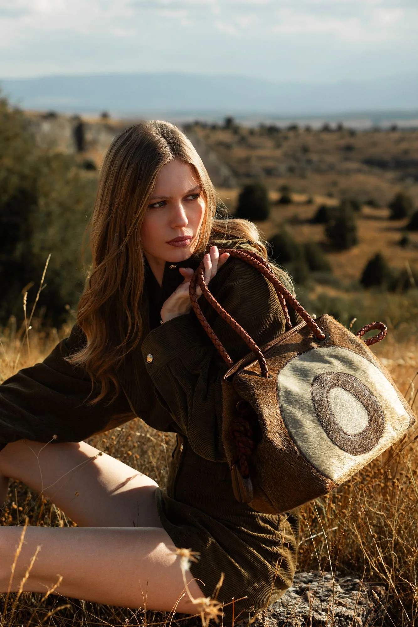 Image may contain Amalie Bruun Accessories Bag Handbag Purse Face Head Person Photography Portrait and Teen