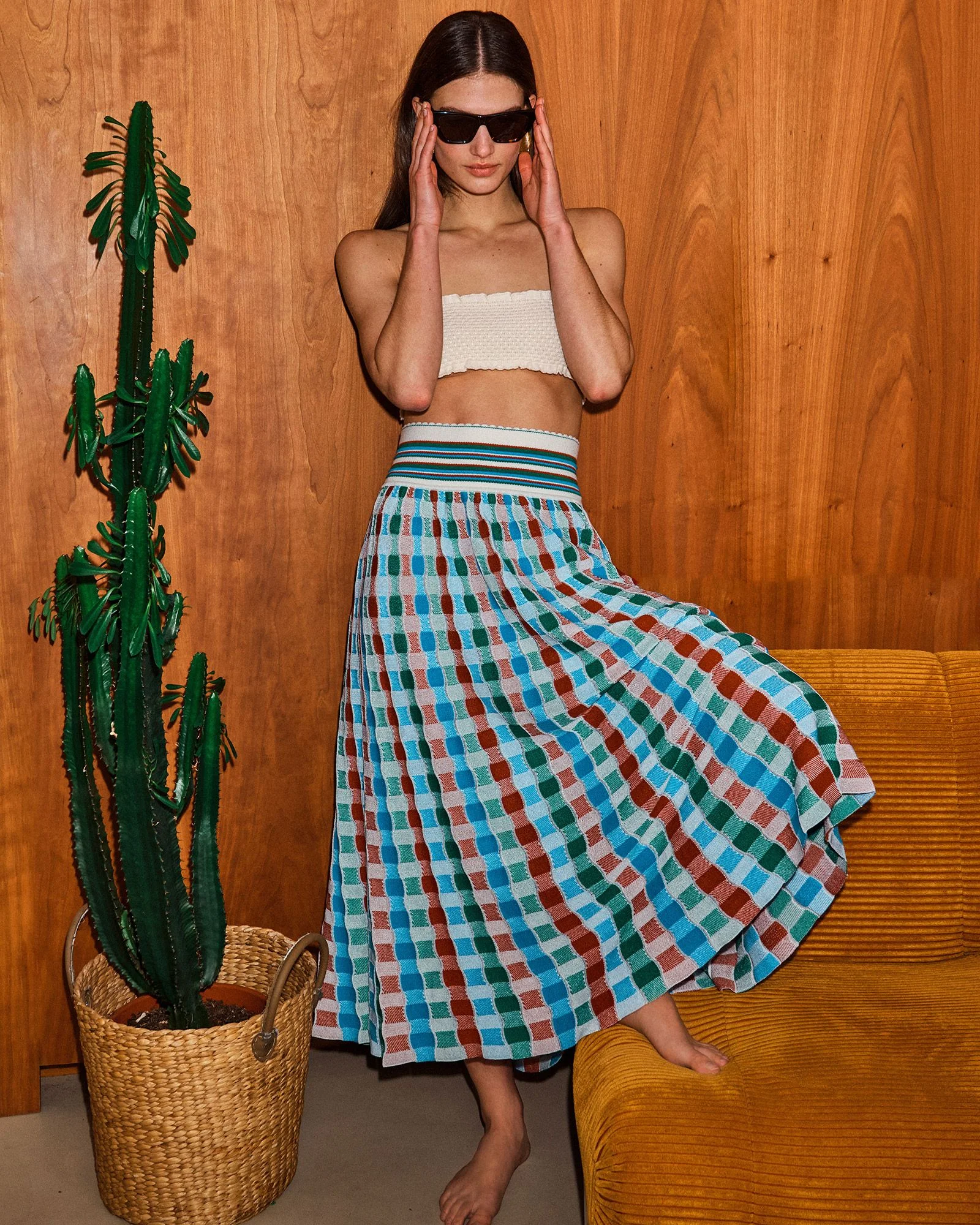 Image may contain Clothing Skirt Adult Person Dress Beachwear and Plant