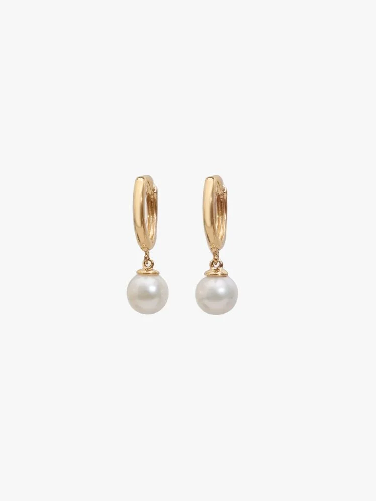 Image may contain: Accessories, Earring, Jewelry, and Pearl