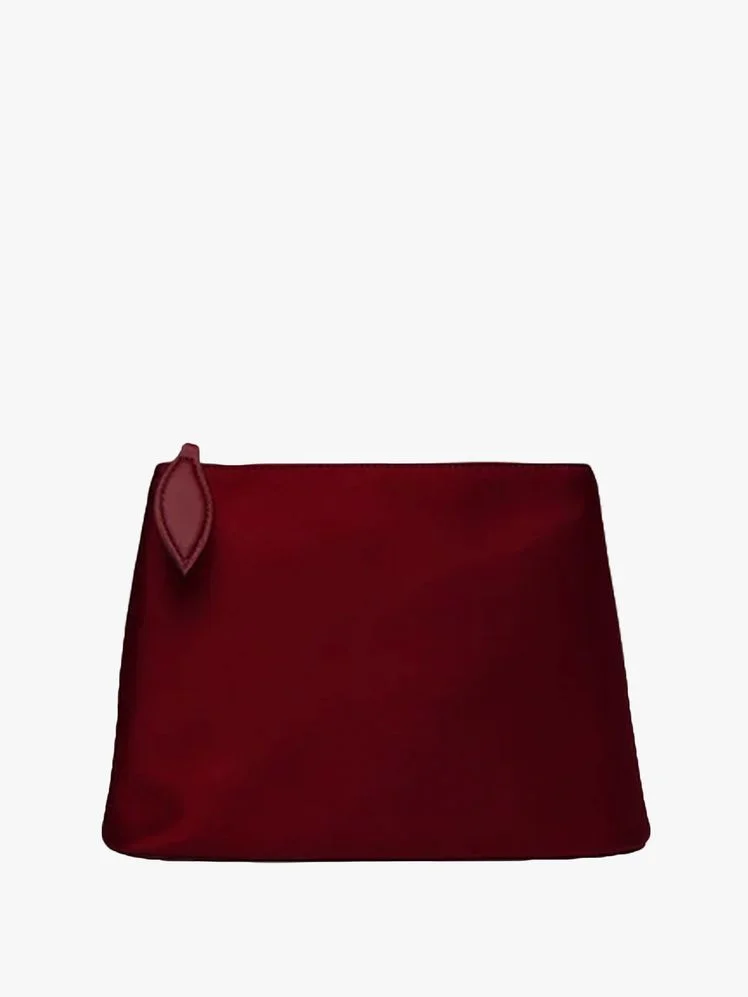 Image may contain: Maroon, Accessories, Bag, Handbag, Cushion, and Home Decor