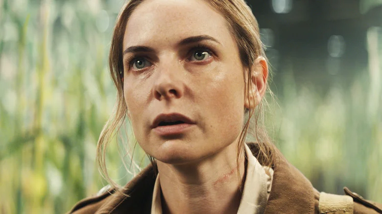 Rebecca Ferguson's Juliette Nichols is seen in closeup as she stands in a field in Silo