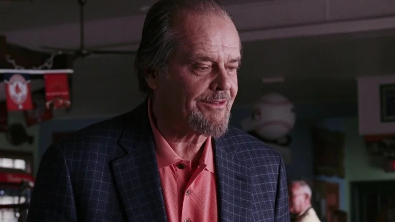 Frank Costello wearing a salmon-colored shirt under a dark jacket in The Departed