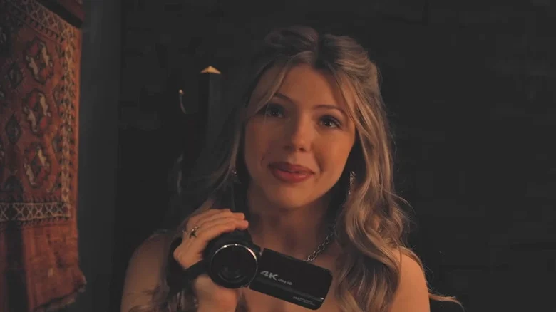 Someone holding a video camera in V/H/S/Mixtape
