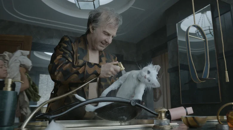 Tom Cruise as Digger Rockwell bathing his cat in Digger