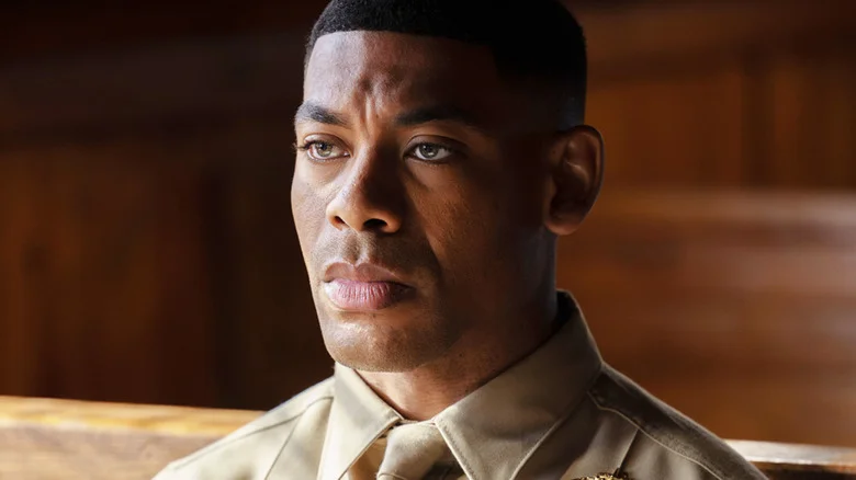 Aaron Pierre's John Stewart is seen in closeup as he sits in military uniform in Lanterns